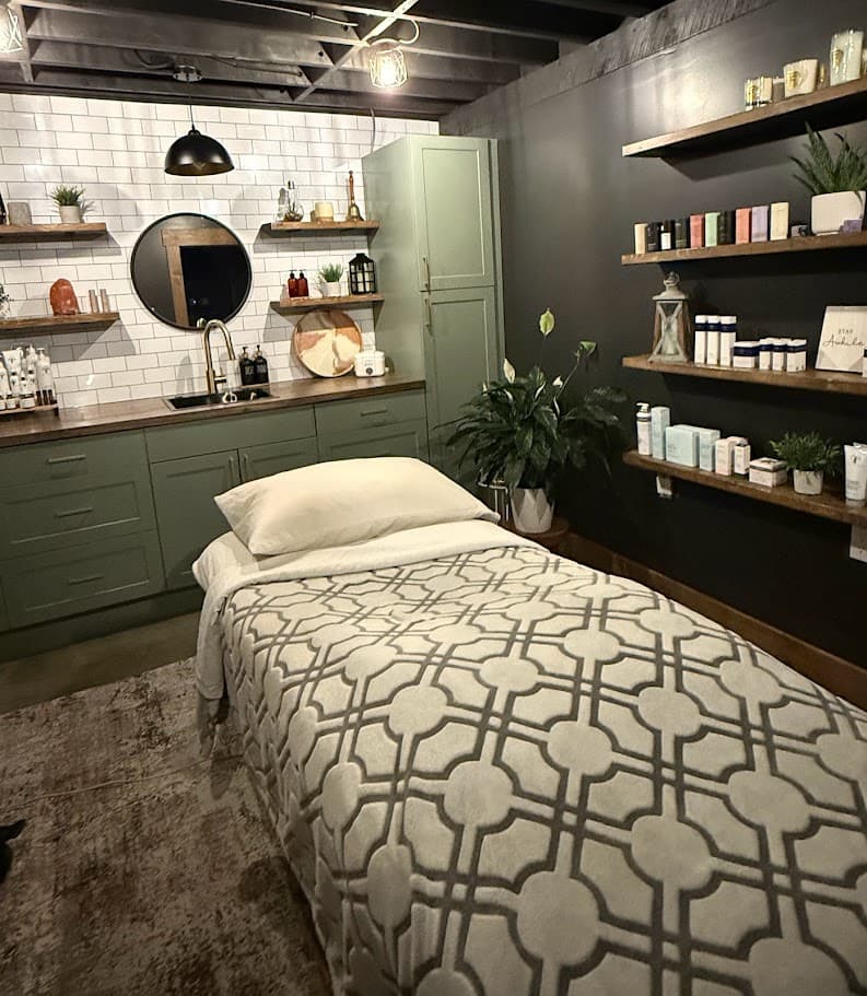 Service room with sage cabinets and subway tile